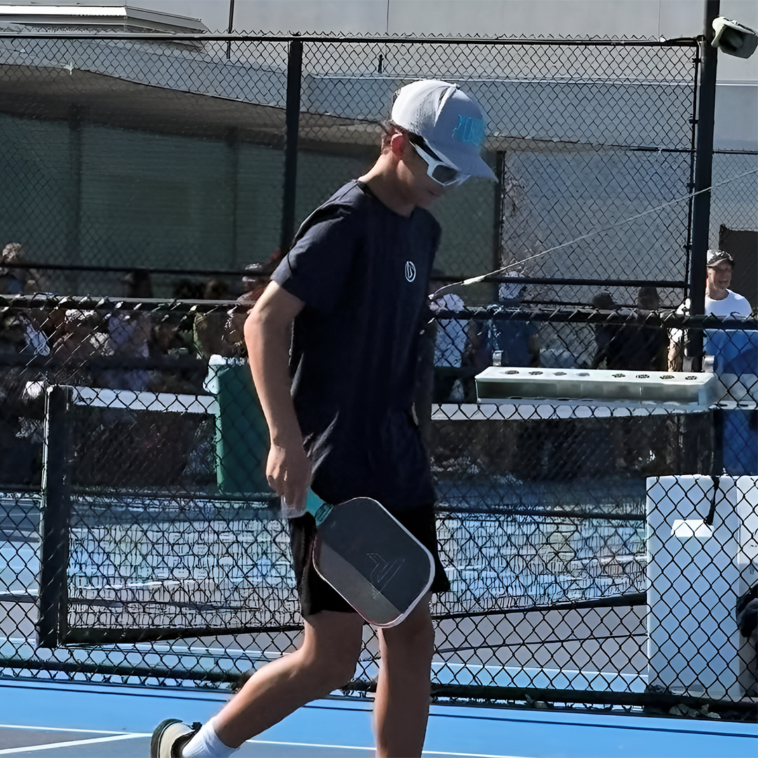 Junior pickleball player Aiden Schliekelman competing with TriggerGrip Pro for better paddle control, power, and elbow and wrist relief