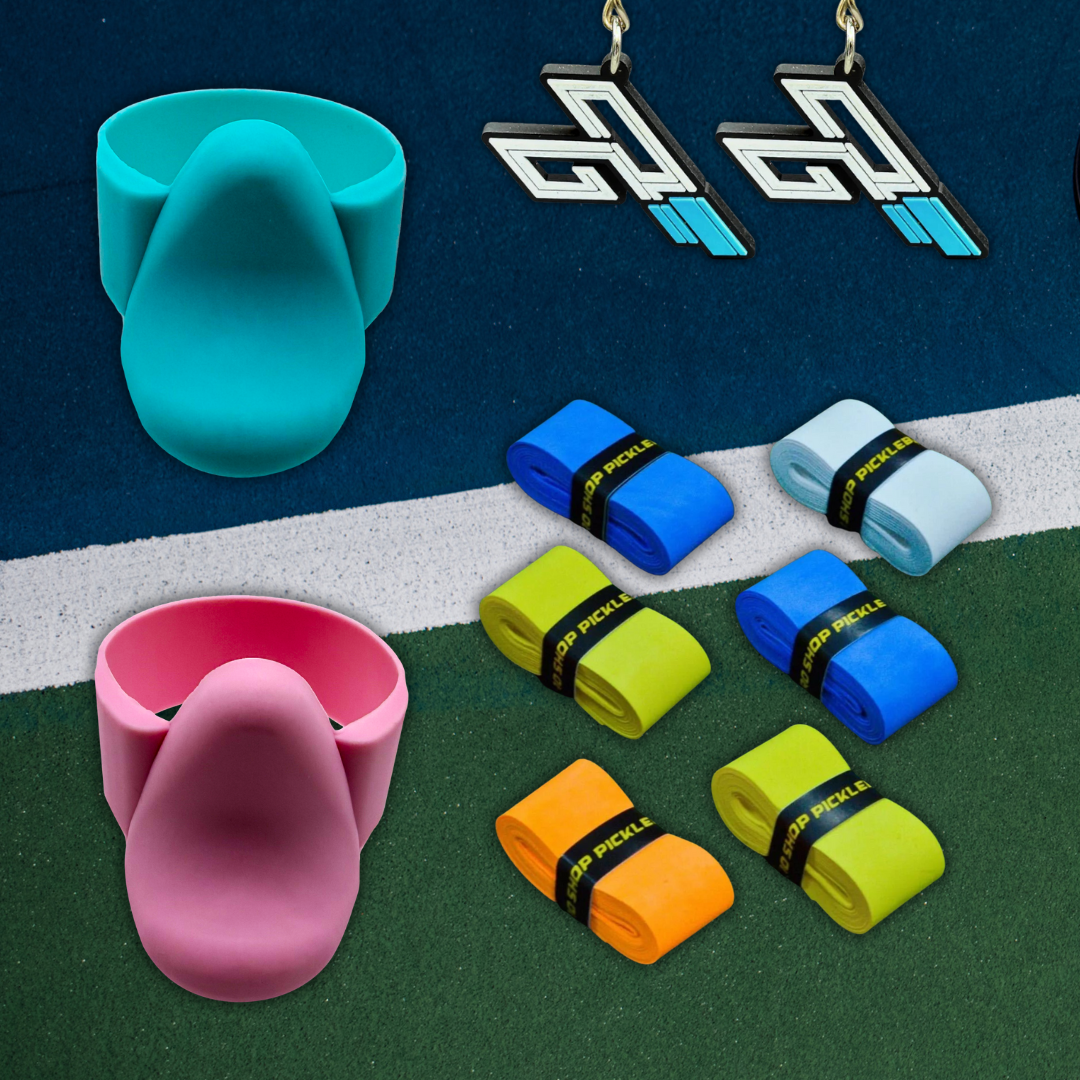 TriggerGrip Pro pickleball grip insert bundle pack with grip inserts, overgrips, and TriggerGrip Pro logo accessories on a court surface